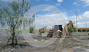 Heavy equipment backhoe in construction site under blue sky