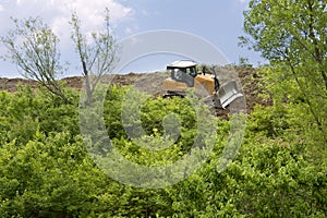 Heavy Equipment Strips Vegetation