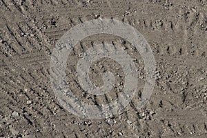 Heavy Equipment Tire Pattern in Dirt Background