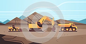 Heavy excavator loading soil on dump truck professional equipment working on coal mine production mining transport