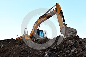 Heavy excavator working at construction site.