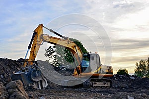 A heavy excavator in a working at granite quarry