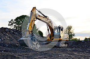 A heavy excavator in a working at granite quarry