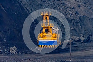 Heavy excavator working in iron ore quarry