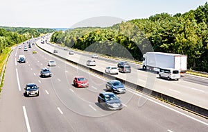 Heavy but fluid traffic on the A10 highway in France by a sunny day