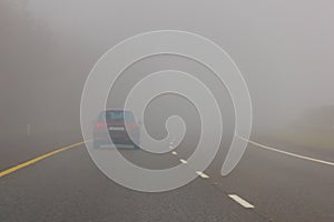 Heavy fog in the motorway. Danger.