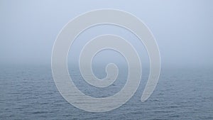 Heavy fog over water surface. Looped seamless video.
