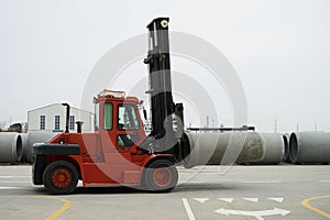 Heavy Forklift loader with concrete pipes