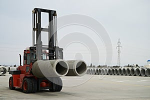 Heavy Forklift loader with concrete pipes