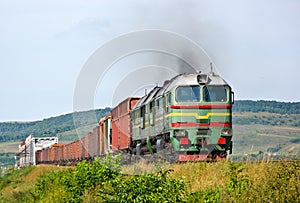 Heavy freight train pulled by diesel locomotive