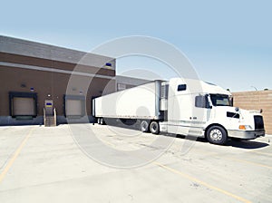 Heavy goods truck loading at warehouse