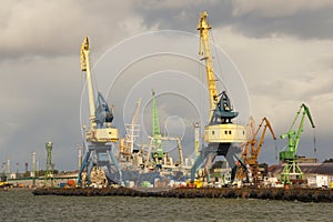 Heavy harbor jib cranes in the Klaipeda Sea Port.