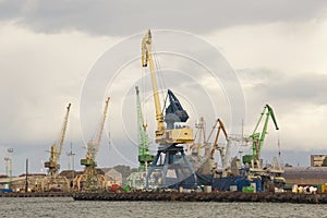 Heavy harbor jib cranes in the Klaipeda Sea Port.