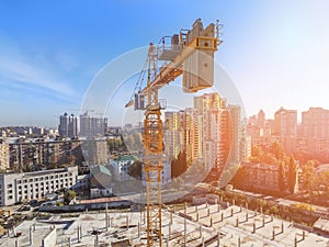 Heavy high tower crane view at skyscraper conctruction site. Industrial building background