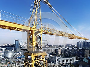 Heavy high tower crane view at skyscraper conctruction site. Industrial building background