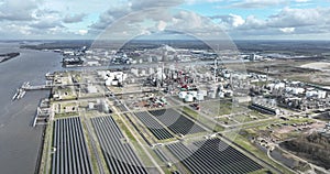 Heavy industrial zone at Moerdijk, including the petrochemical refinery along the Hollands Diep canal river, solar