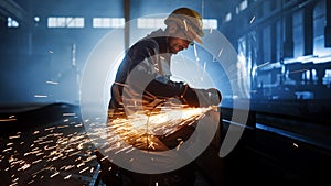 Heavy Industry Engineering Factory Interior with Industrial Worker Using Angle Grinder and Cutting