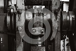 Heavy industry old grunge steel machinery mechanical engineering machine closeup black and white for background