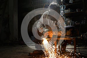 Heavy industry worker cutting steel with gas in workshop. Steel Workers welding, grinding, cutting in metal industry.