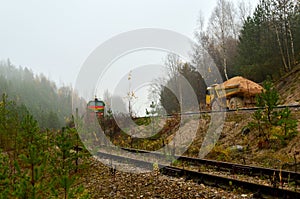 Heavy large quarry dump truck. Big wheels. The work of construction equipment in the mining industry. Production useful minerals