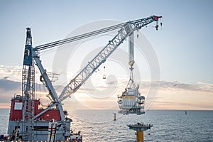 Heavy Lift Crane Vessel installing a topside on a monopile photo