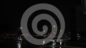 Heavy lightning storm over empty parking lot out the street. Wide shot footage