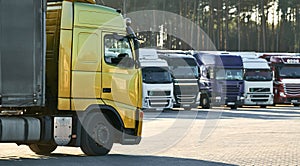 Heavy lorry truck at trucker parking. Logistics and transportation service