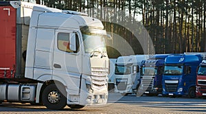 Heavy lorry truck at trucker parking. Logistics and transportation service