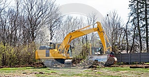 Heavy Machinery Breaking Up Ground