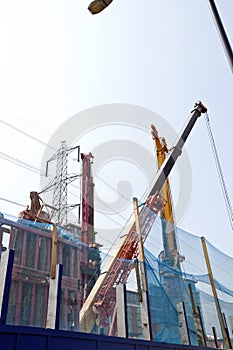 Heavy machinery digging foundations on building site