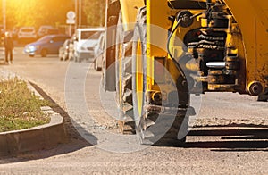 Heavy machinery, excavator on construction site, close-up to the big wheels, banner