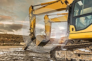 Heavy machinery in a hard day of work in the construction of a road