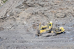 Heavy machinery in the process of mountain road construction works in Saudi Arabia