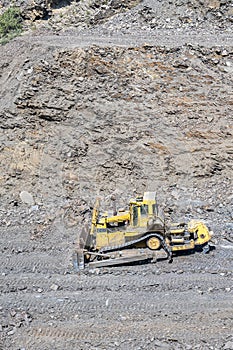 Heavy machinery in the process of mountain road construction works in Saudi Arabia