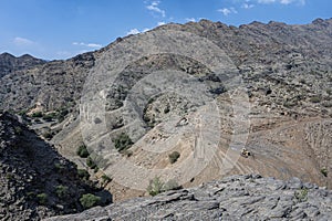 Heavy machinery in the process of mountain road construction works in Saudi Arabia