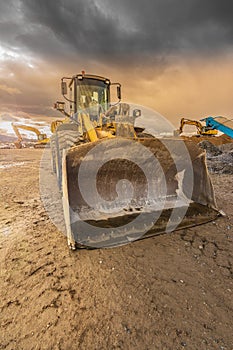 Heavy machinery for stone transport and gravel transformation for construction of a road