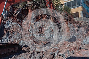 Heavy machinery works at the construction site. Clearing rocky soil for construction in Turkey