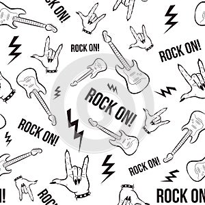 Heavy metal and grunge  seamless pattern with hands and electric guitars. Repetitive rock and roll background