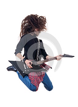 Heavy metal guitarist jumps in the air