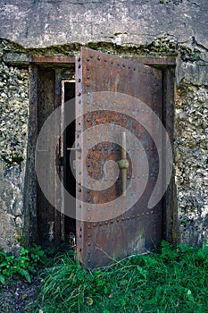 Heavy metal, rusty door to the military facility
