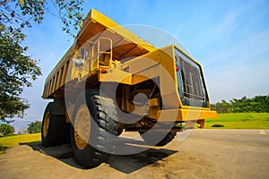 Heavy mining truck in mine and driving along the opencast. Photo of the big mine truck, The career heavy-load super car