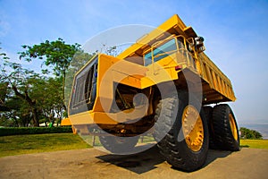 Heavy mining truck in mine and driving along the opencast. Photo of the big mine truck, The career heavy-load super car