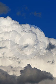 Heavy plumpy clouds on blue sky