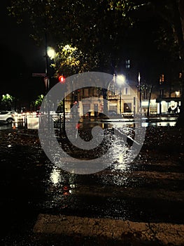 Heavy rain in the city of Turin with traffic lights