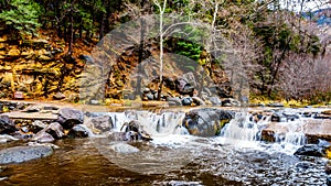 After heavy rainfall, water from Oak Creek flooding the road crossing Oak Creek at Orchard Canyon between Sedona and Flagstaff