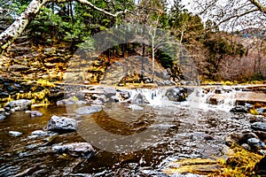 After heavy rainfall, water from Oak Creek flooding the road crossing Oak Creek at Orchard Canyon between Sedona and Flagstaff