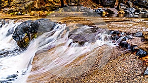 After heavy rainfall, water from Oak Creek flooding the road crossing Oak Creek at Orchard Canyon between Sedona and Flagstaff