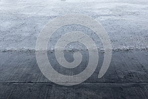 Heavy raining on concrete floor. The photographer took the raining picture while shelter under roof from the rain.