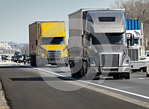 Heavy Semi Trucks Convoy On The Interstate