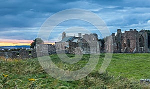 Heavy sky at Sunset over Lindisfarne Priory, Holy Island.